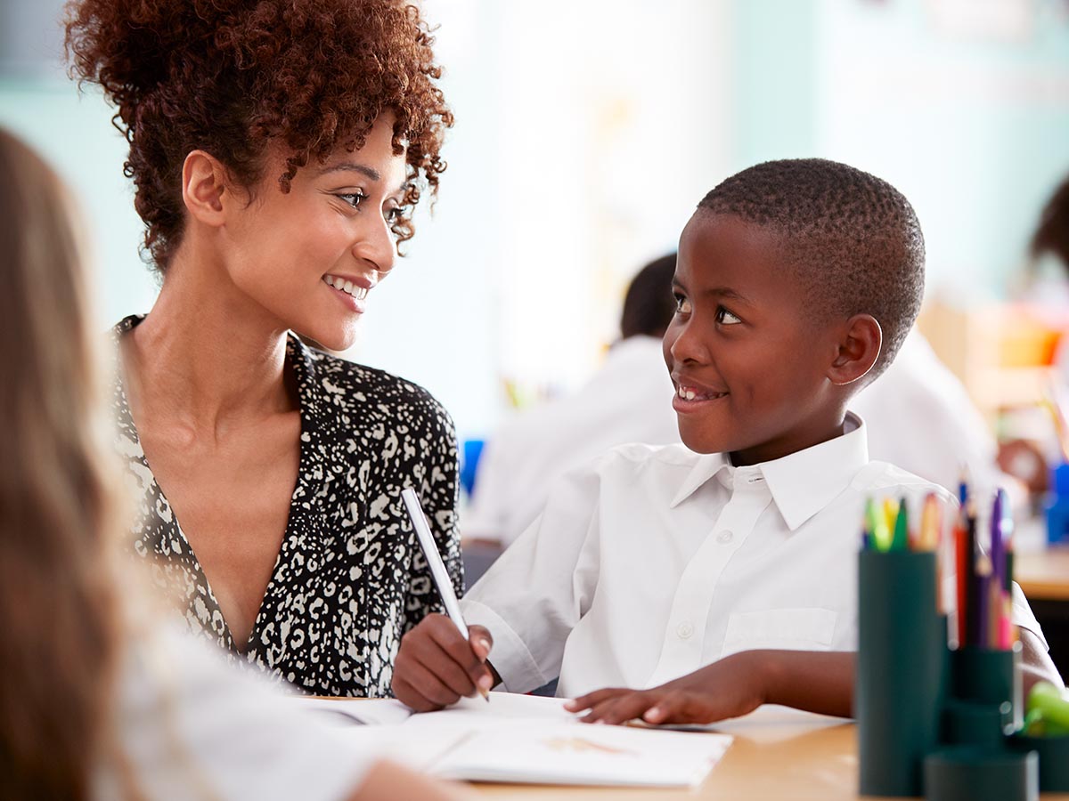Smiling teacher and student