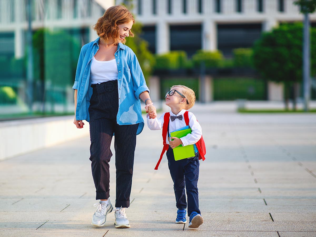 Mother walking with child to school