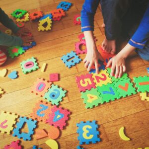 child playing with number blocks