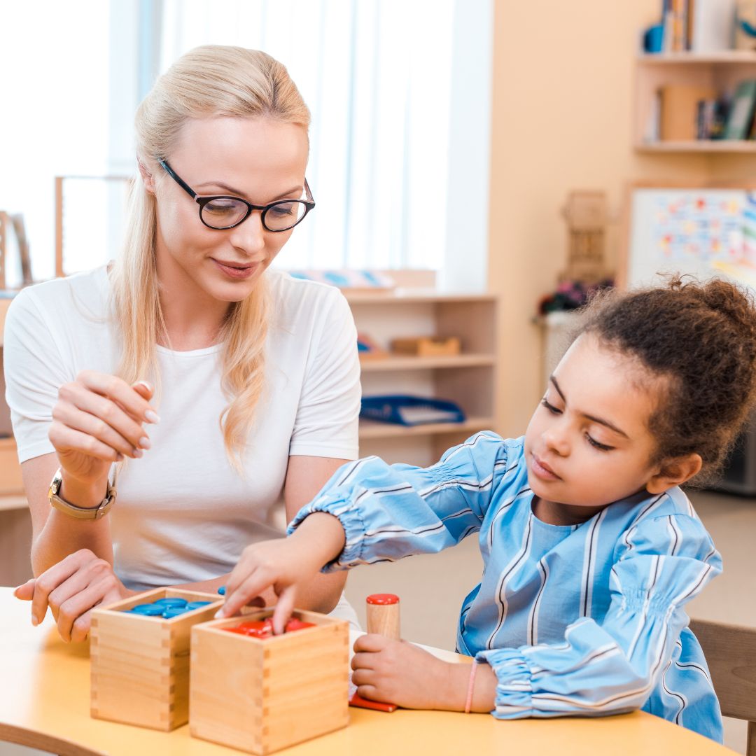 Montessori teacher meeting with child
