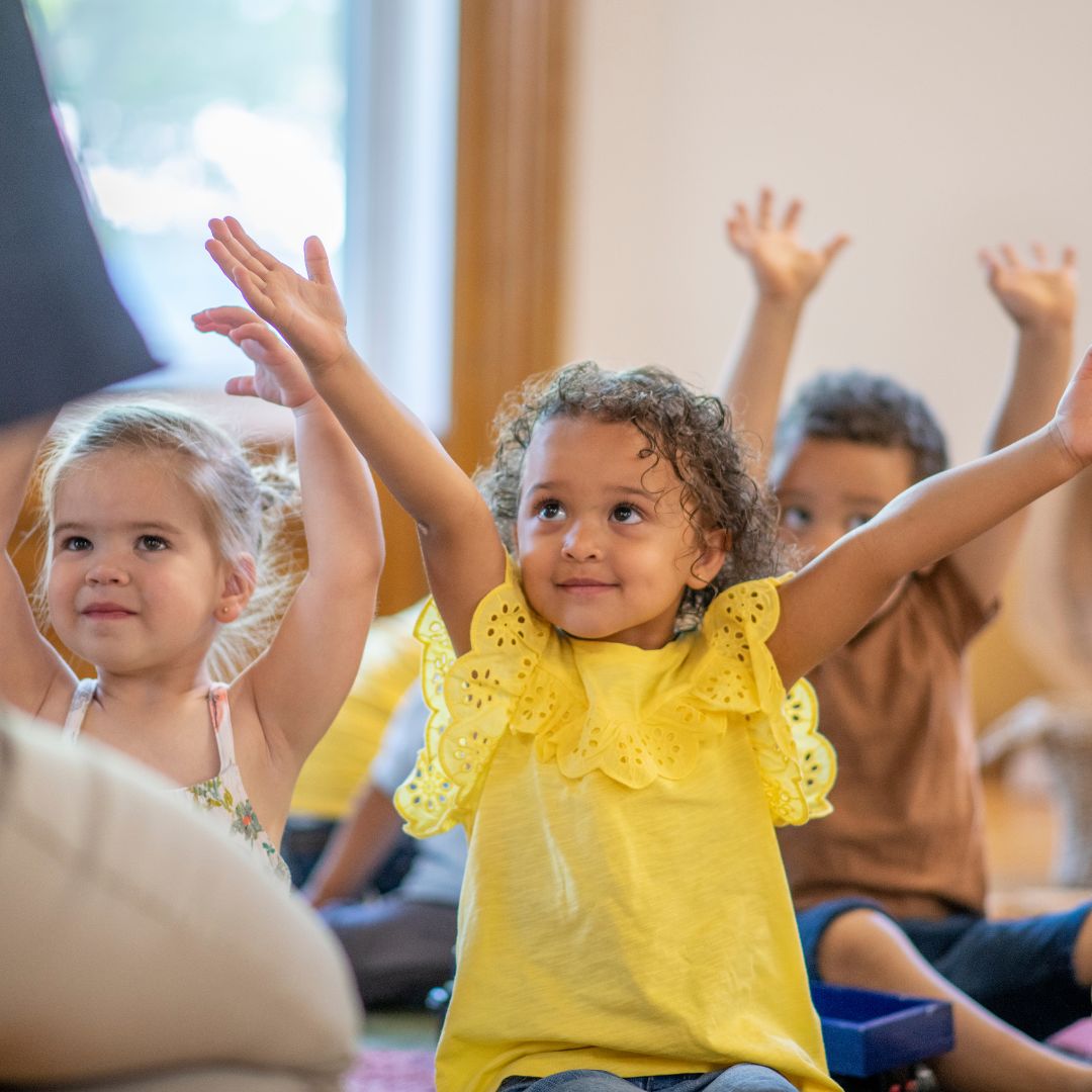 preschools raising their hands