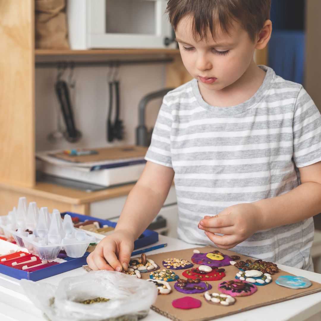 a boy making clay decorations