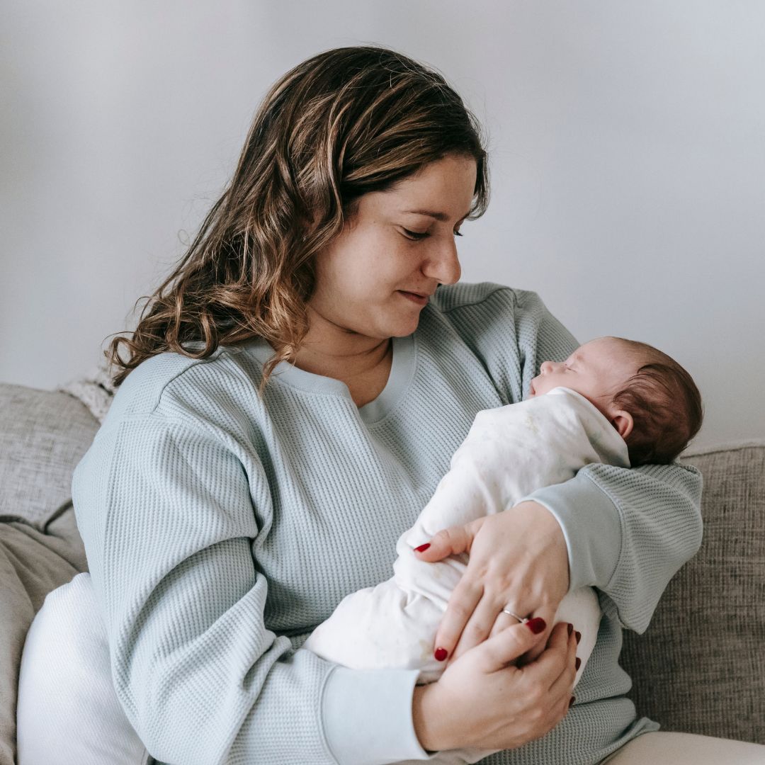 A dedicated staff member caring for an infant