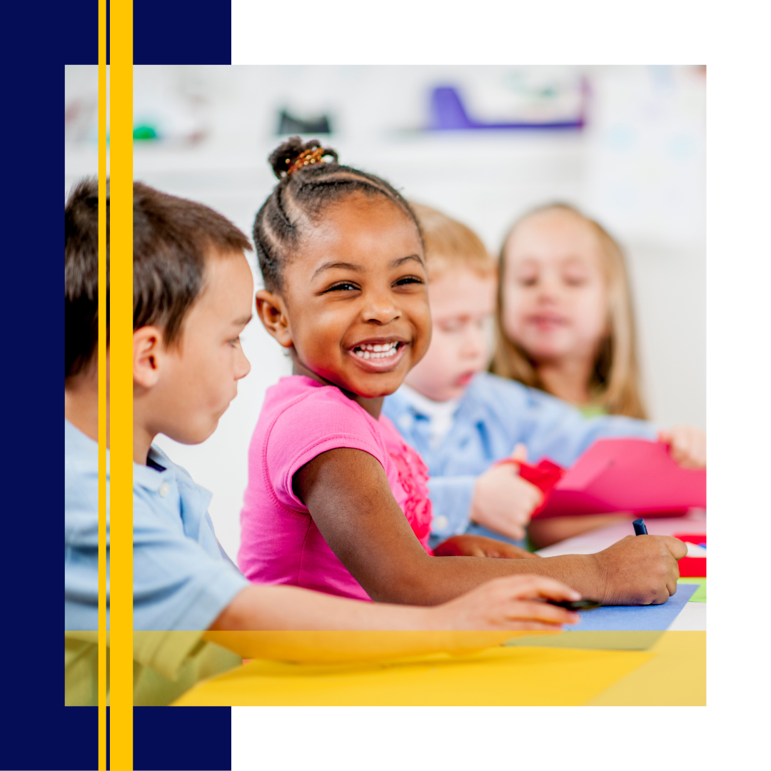 Preschool girl smiling while doing crafts