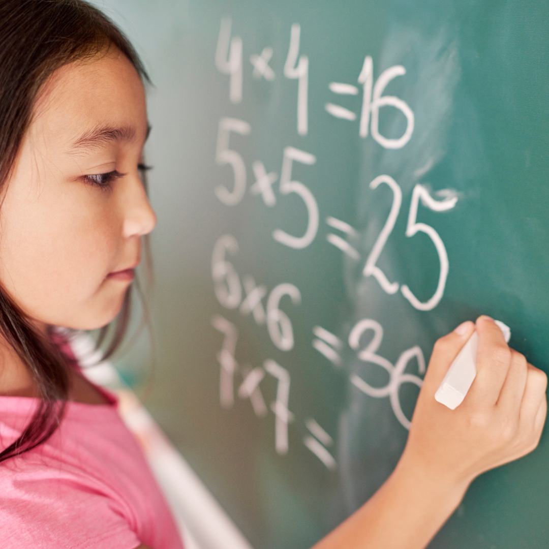 image of a girl doing a math problem