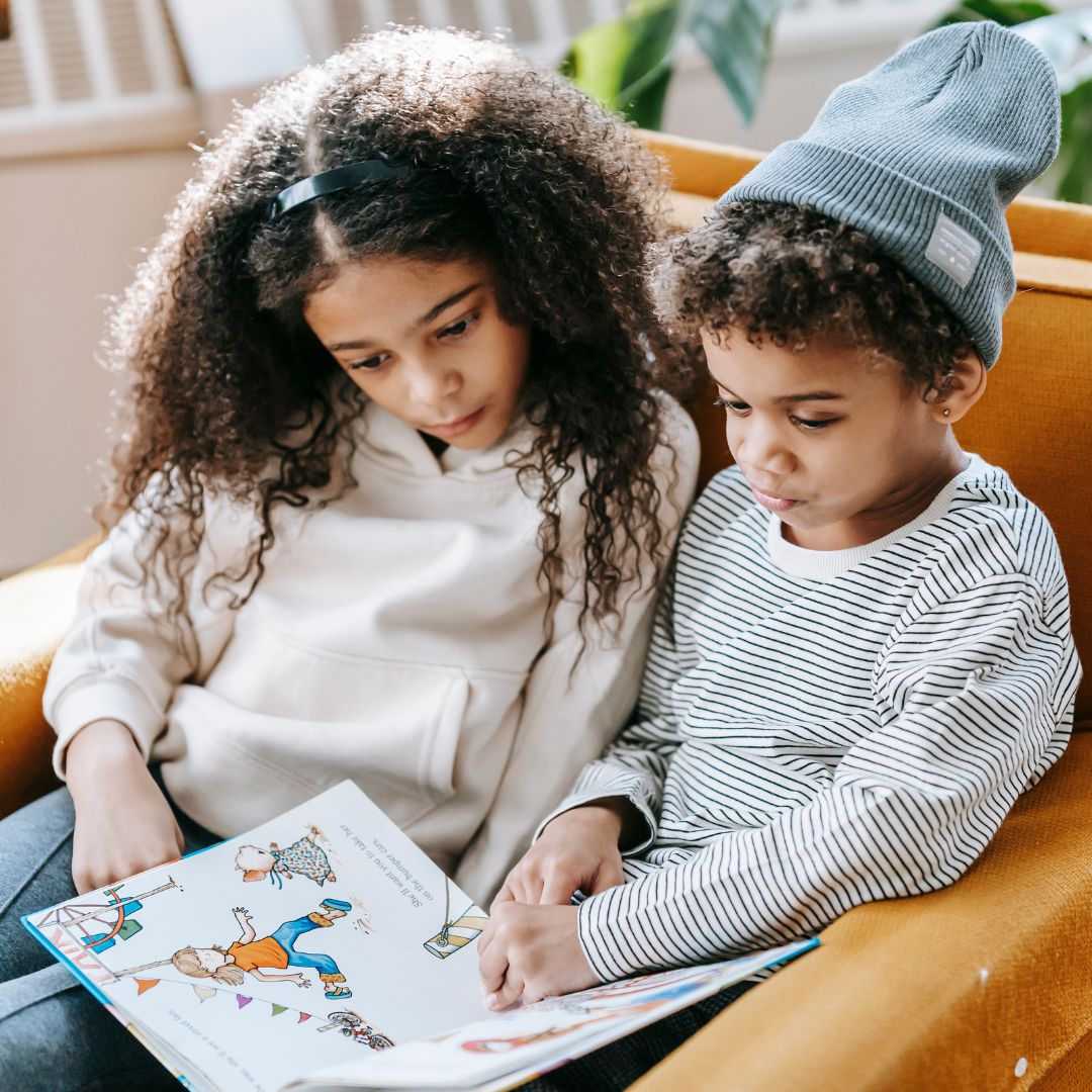 two kids reading together