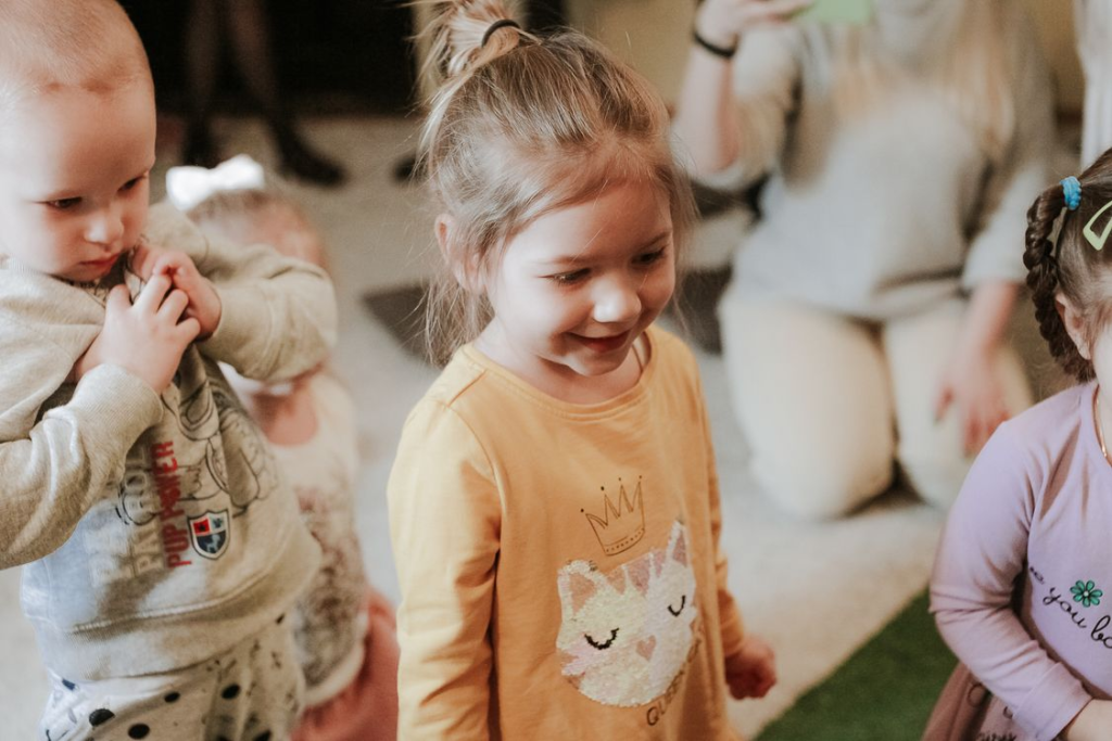 Happy children playing indoors together.