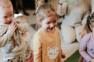 Happy children playing indoors together.