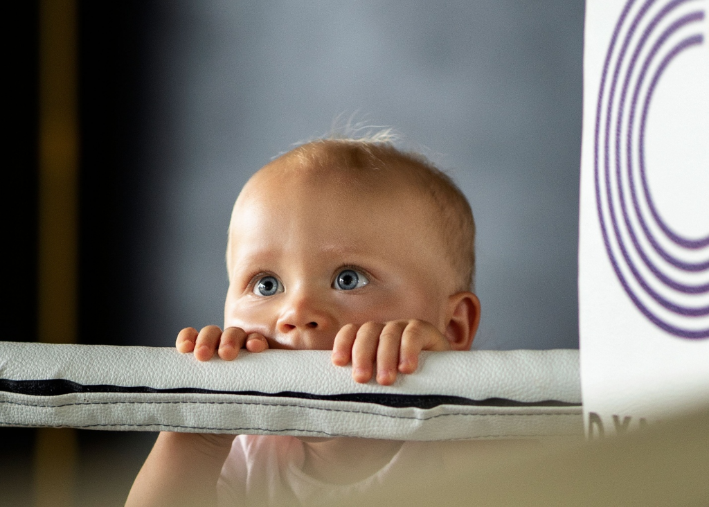 A toddler looking curious