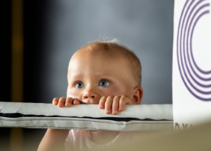 A toddler looking curious